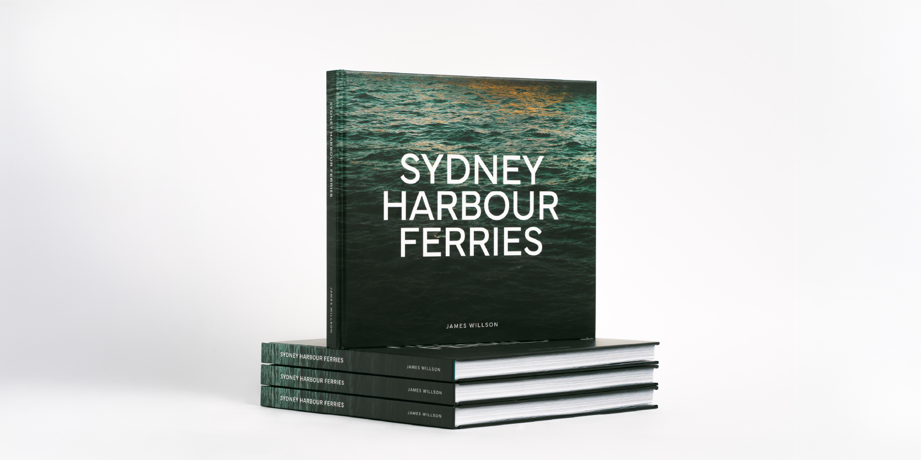 The Sydney Harbour Ferries book standing on a stack with a white background