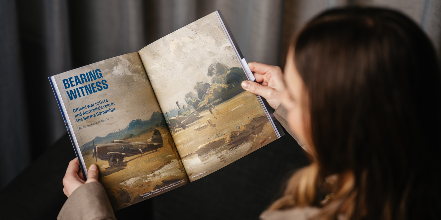 A woman holding the WM Magazine