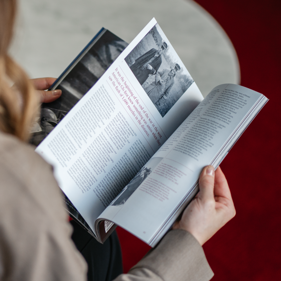 A woman flicking through WM Magazine