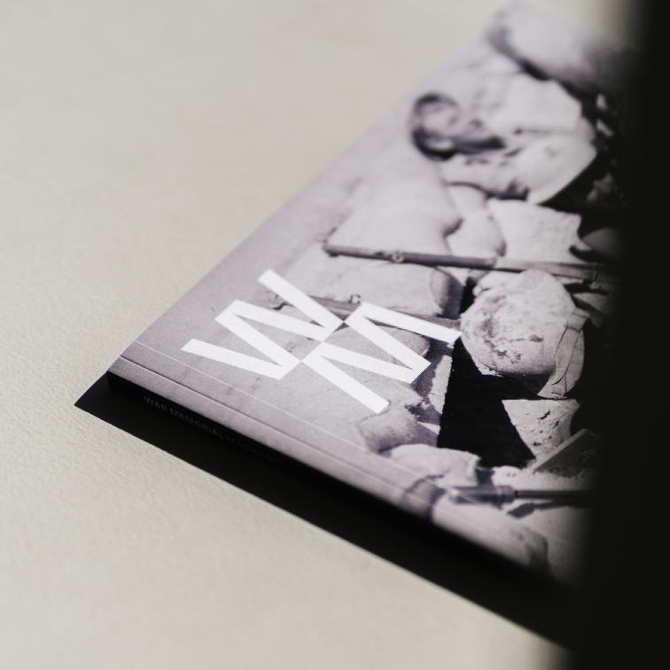 A close up of the logo on the cover of WM Magazine